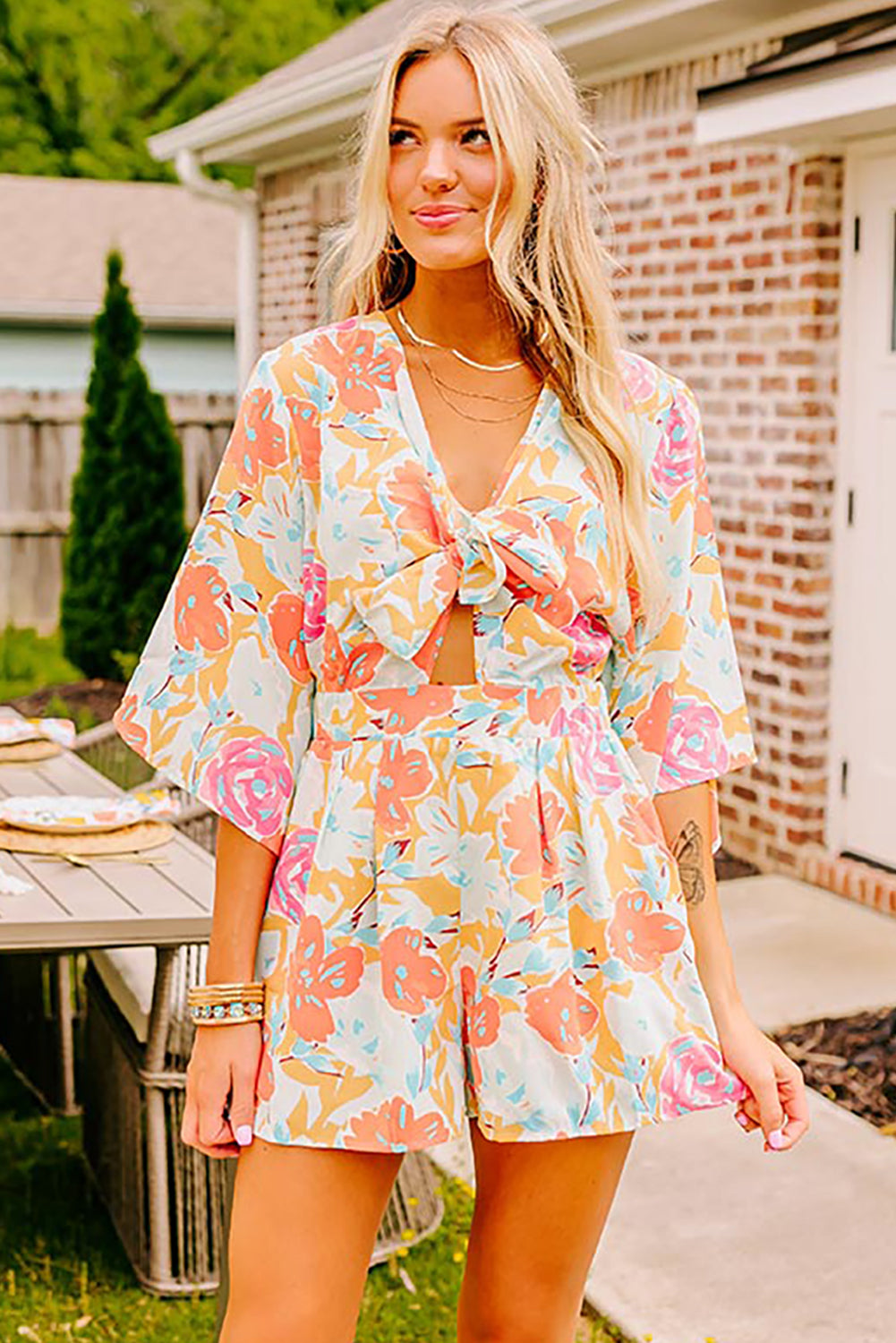 Orange Floral Print Front Tie V Neck Romper